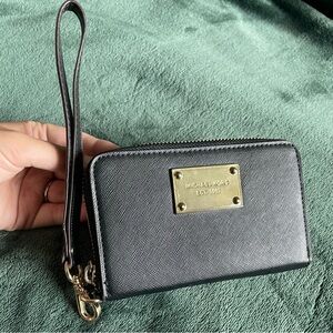 Micheal Kors black and gold small wristlet wallet
